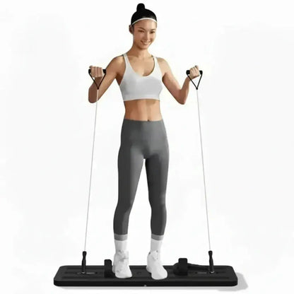 Turquoise fitness mat with various attachments and a woman demonstrating its use.